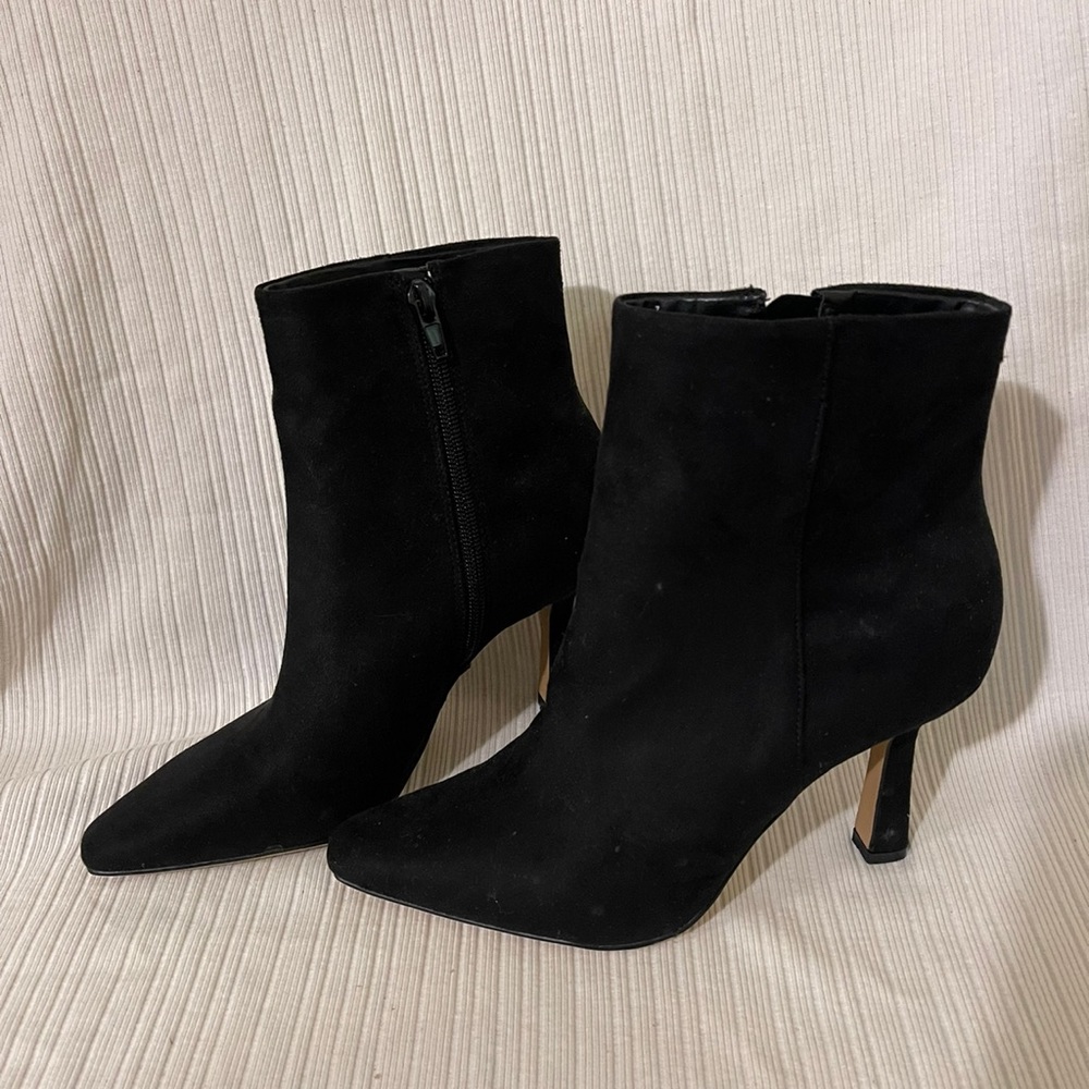 Black boots. Novelty thin heel! Never worn but they were the floor model.